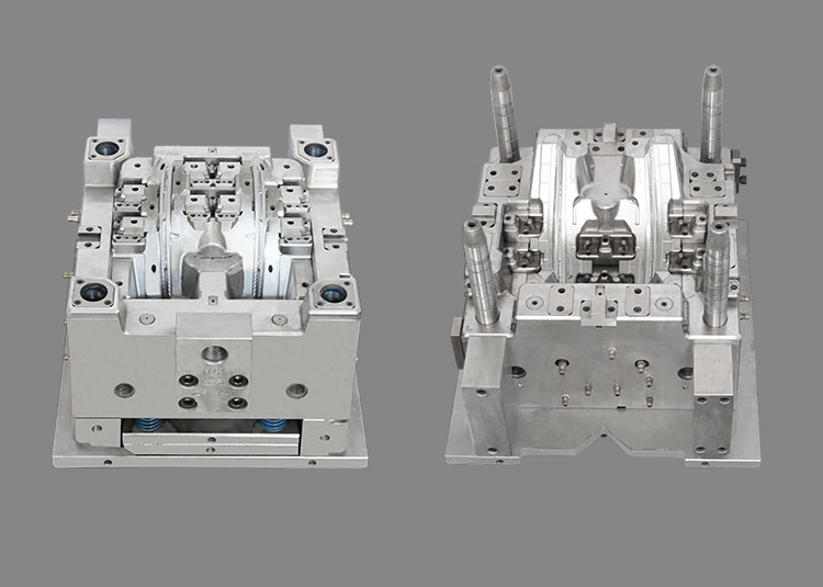 Two upright light-guide mould halves with guide pillars